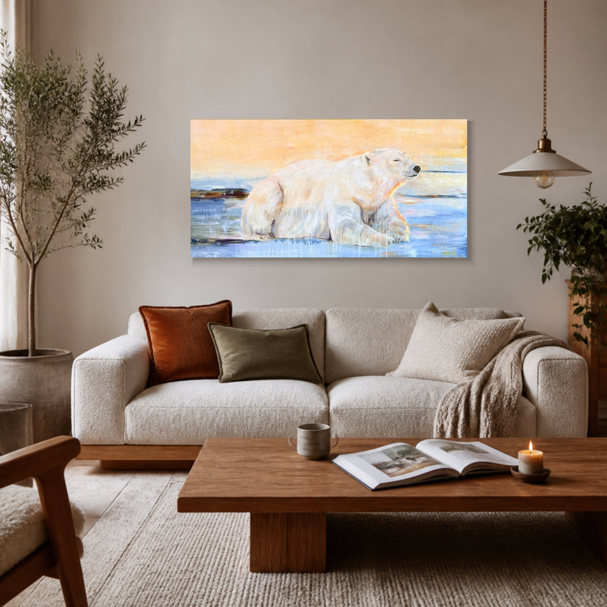 What Awaits hanging above an oatmeal sofa in a living room, shown at true size